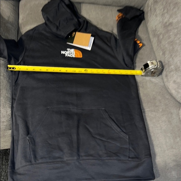 The North Face Charcoal Hoodie with Vibrant Orange Sleeve Design - Picture 4 of 14